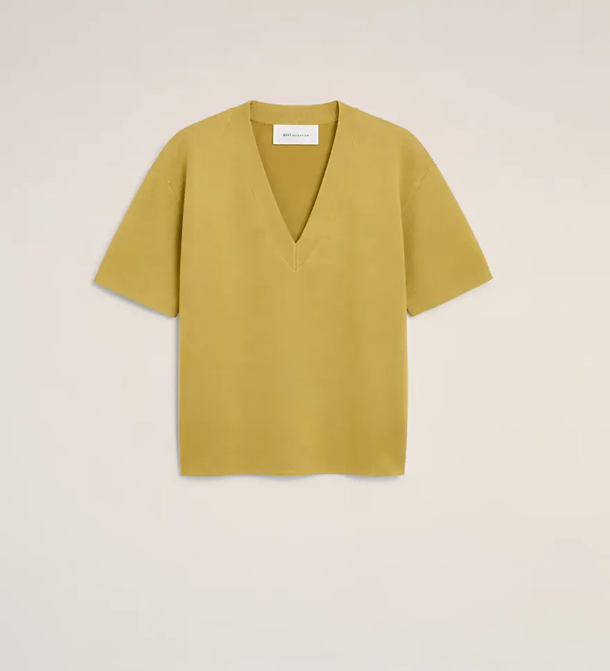 Knitted V-neck top in olive, laid flat
